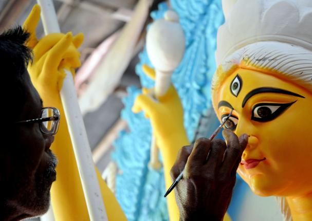Goddess Durga's idol being painted by an artisan in Kumartuli Picture Courtesy: The Hindu